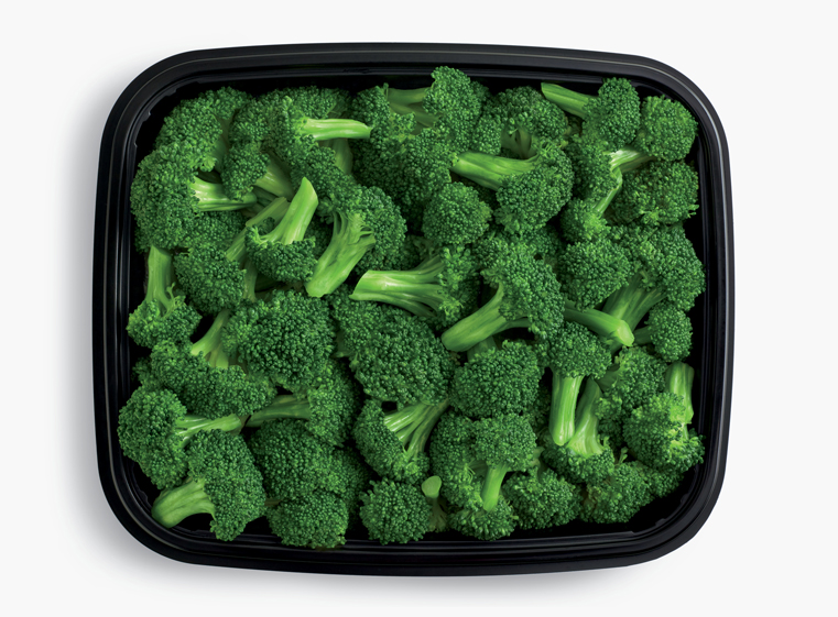 Open catering container of steamed broccoli