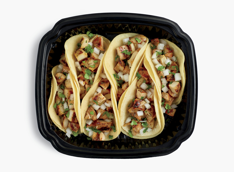 Open catering container of Tacos al Carbon six-pack