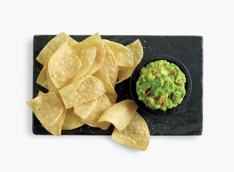 Tortilla chips with side of guacamole