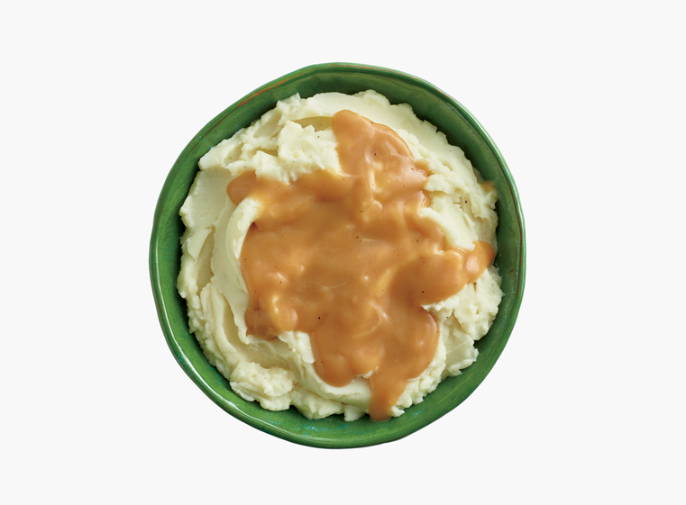 Bowl of mashed potatoes and gravy